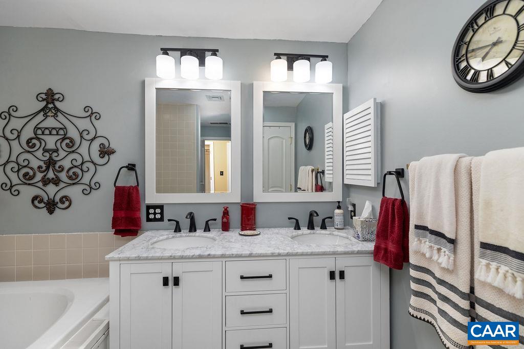 1707 High Ridge Wintergreen, VA 22967 - Photo 20 of 27 a bathroom with a sink and a mirror