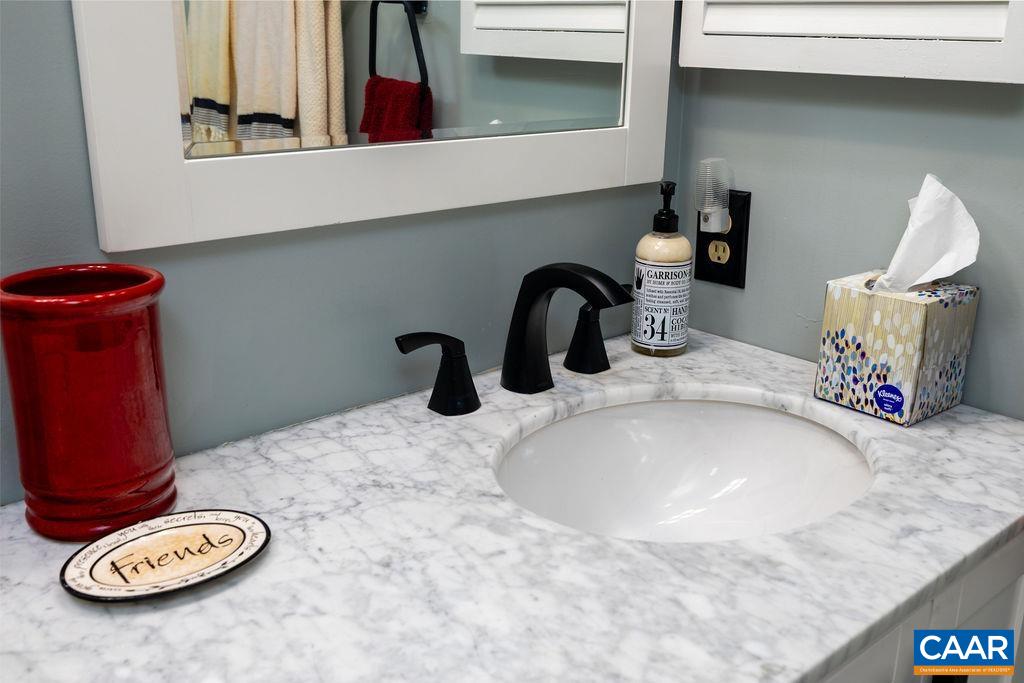 1707 High Ridge Wintergreen, VA 22967 - Photo 22 of 27 a bathroom with a sink and a mirror