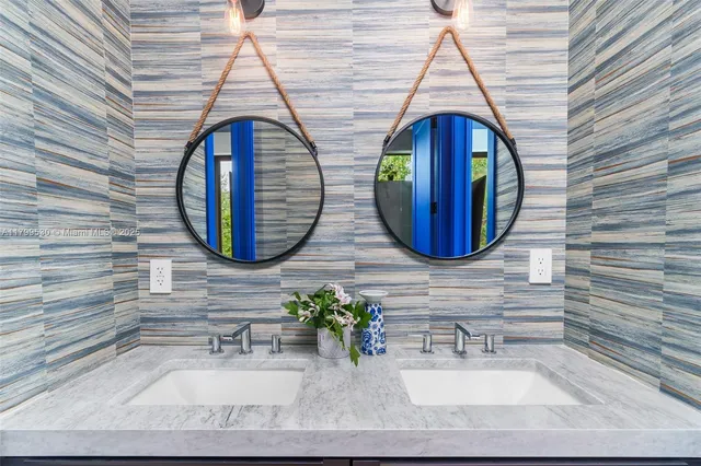 a bedroom with a bed and a large window with outer view