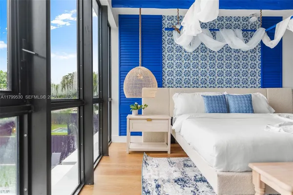 a bathroom with a potted plant and a shower