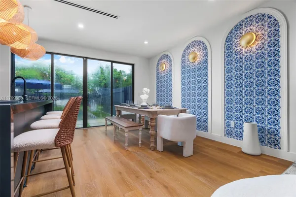 a very nice looking living room with furniture and a large window