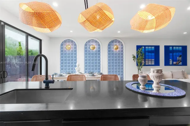 a view of a dining room with furniture and chandelier