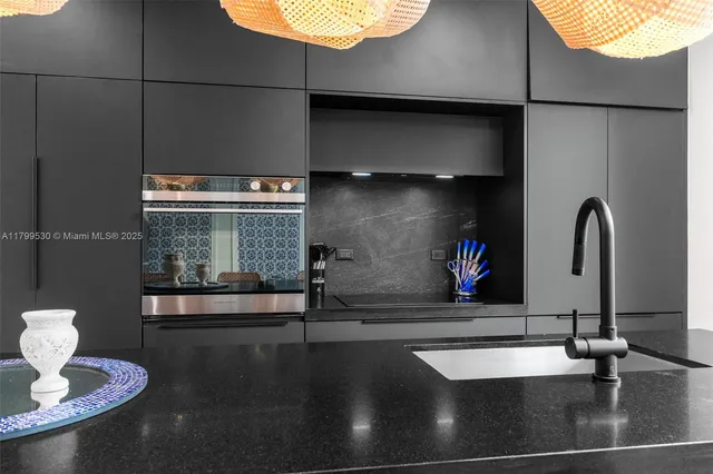 a kitchen with a sink and a stove