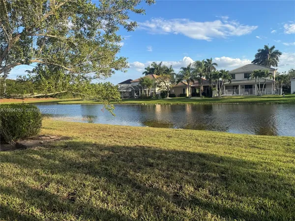 an aerial view of a house with a lake view