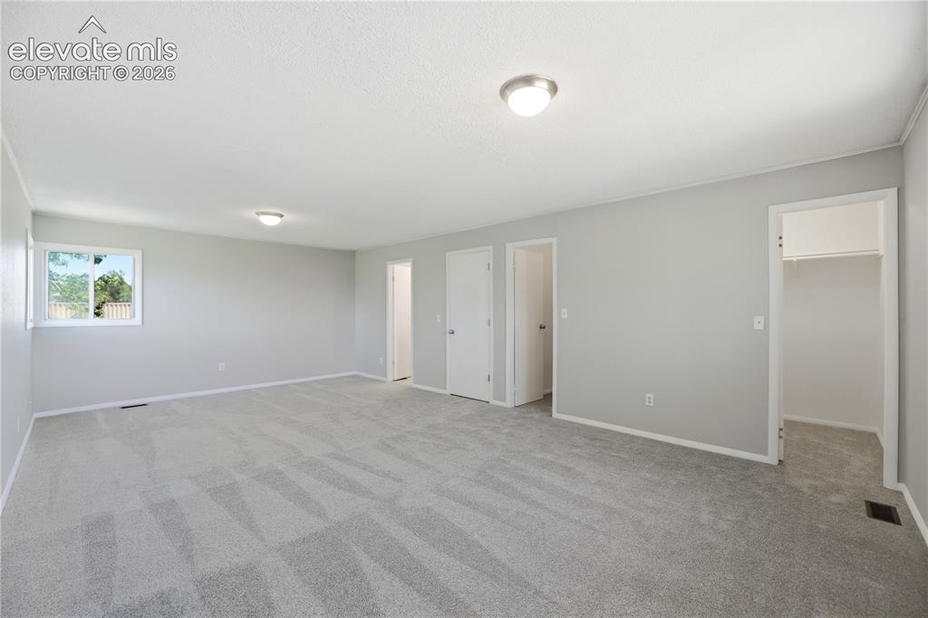 19027 Murphy Road Peyton, CO 80831 - Photo 19 of 48 Carpet, Dual Closets, Primary Bath, Large Room, Windows All Around