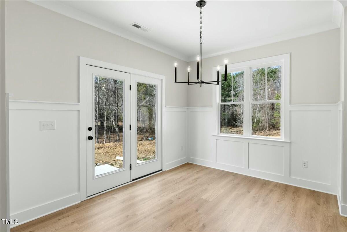 109 Averly Court Stem, NC 27581 - Photo 23 of 36 a view of empty room with wooden floor and fan