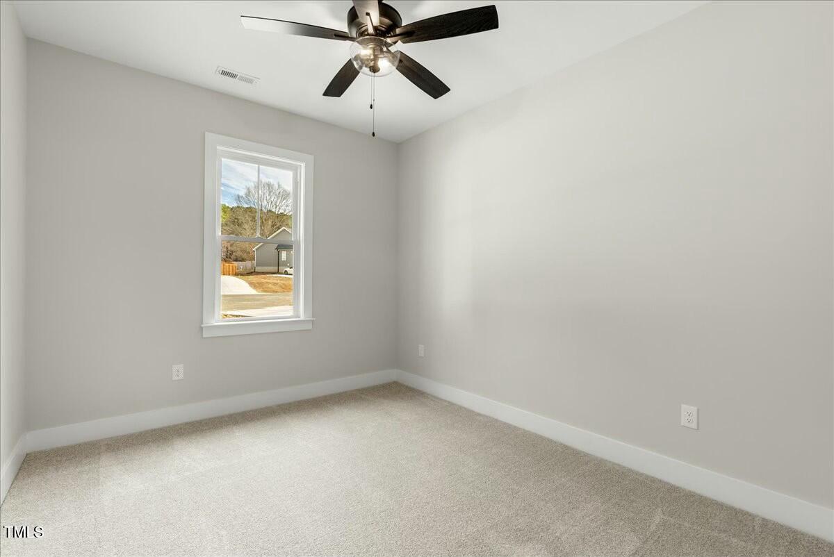 109 Averly Court Stem, NC 27581 - Photo 29 of 36 an empty room with windows and fan