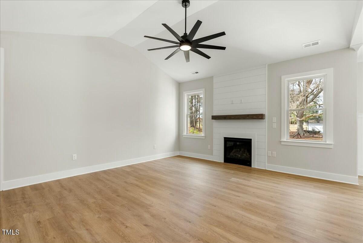 109 Averly Court Stem, NC 27581 - Photo 34 of 36 a view of an empty room with window and a fireplace