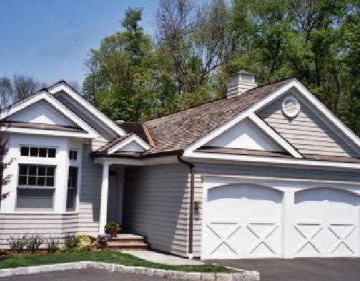 306 Danbury Road, Unit 5 Wilton, CT 06897 - Photo 1 of 1 a front view of a house with a yard