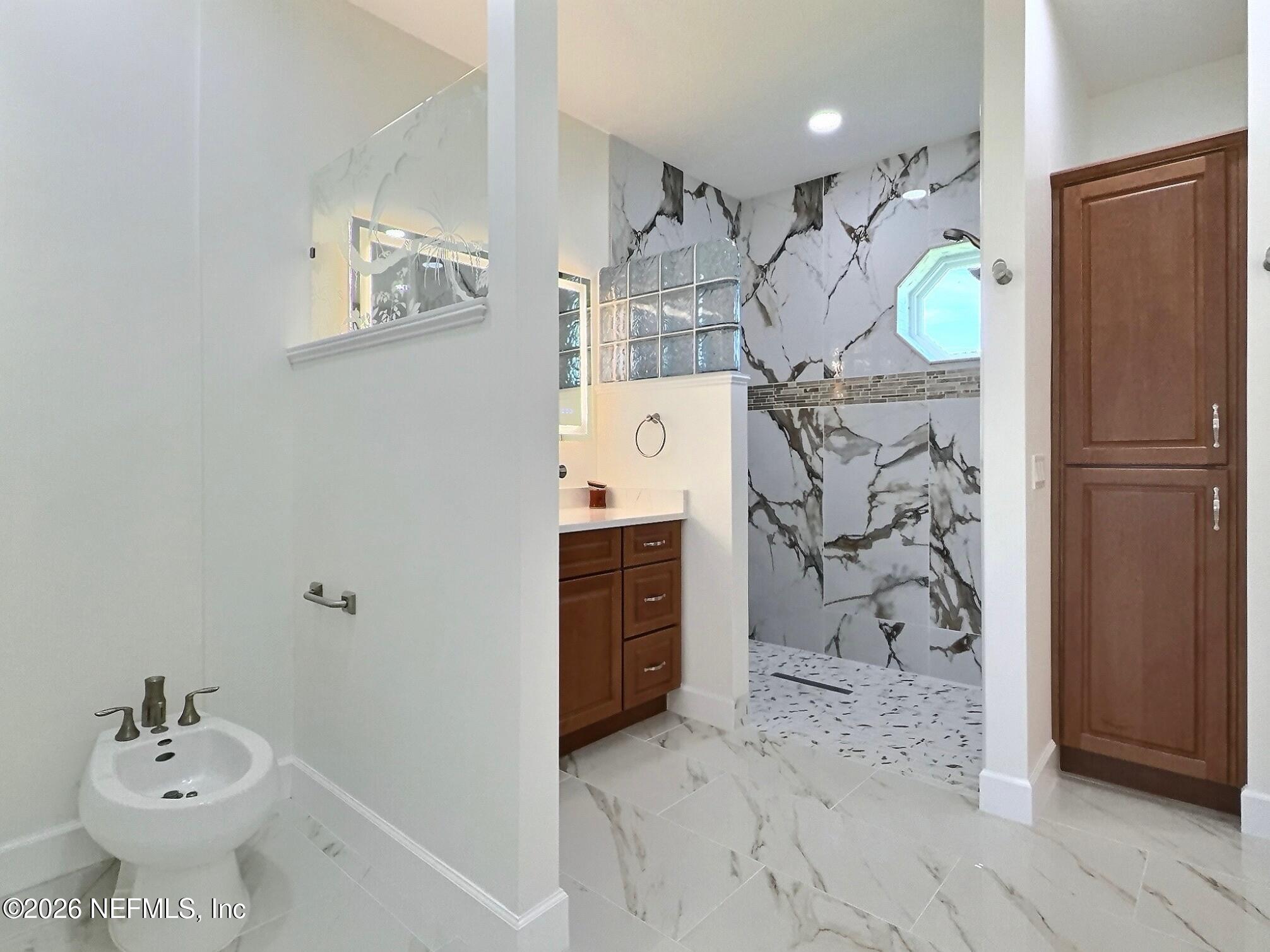 159 Mays Cove Road East Palatka, FL 32131 - Photo 22 of 62 a bathroom with a sink vanity granite and a shower