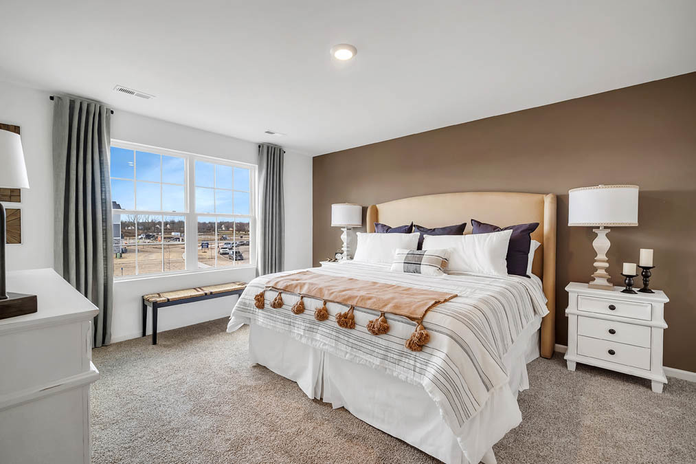 263 Canal Drive St. Charles, IL 60174 - Photo 11 of 29 a spacious bedroom with a bed and a large window