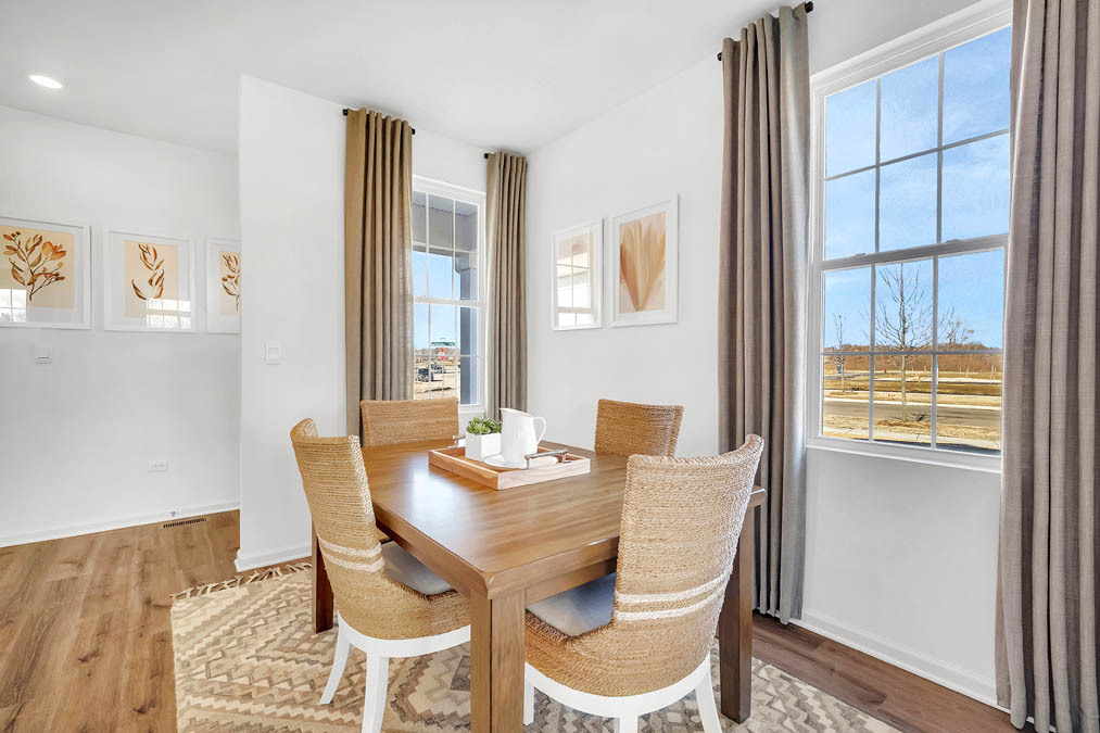 263 Canal Drive St. Charles, IL 60174 - Photo 4 of 29 a view of a dining room with furniture and wooden floor
