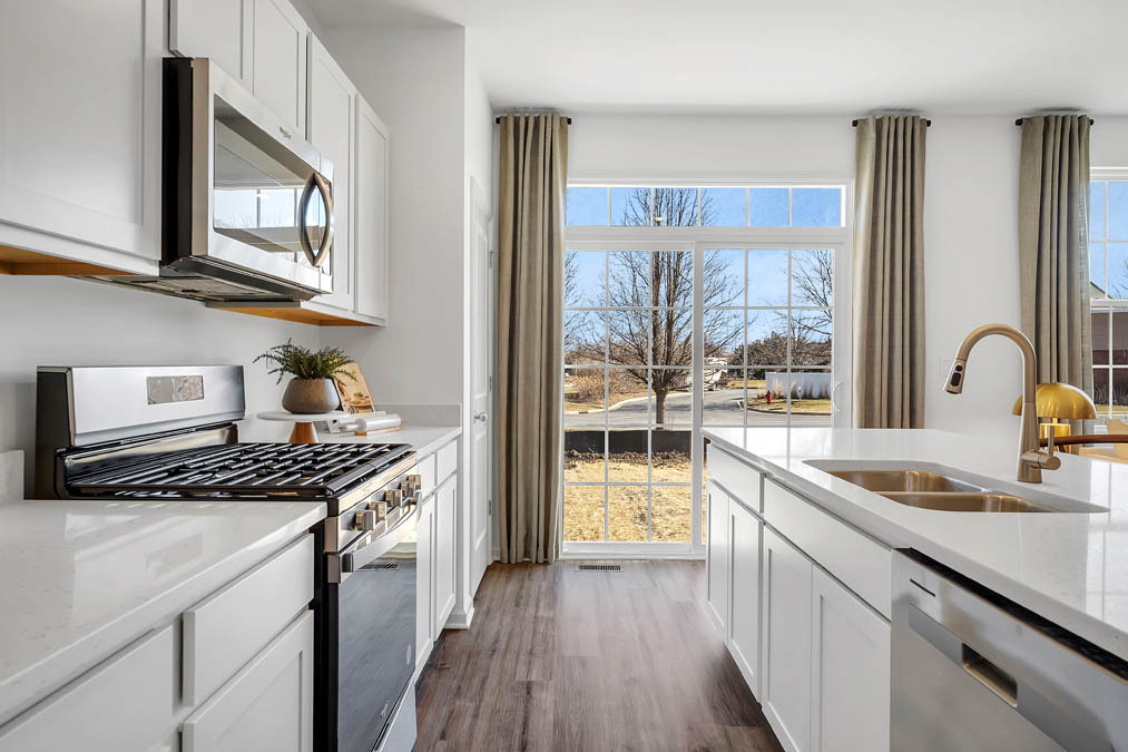 263 Canal Drive St. Charles, IL 60174 - Photo 8 of 29 a kitchen with stainless steel appliances granite countertop a sink stove and cabinets