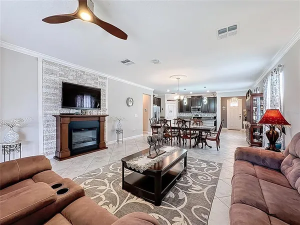 a bedroom with a bed dresser and window
