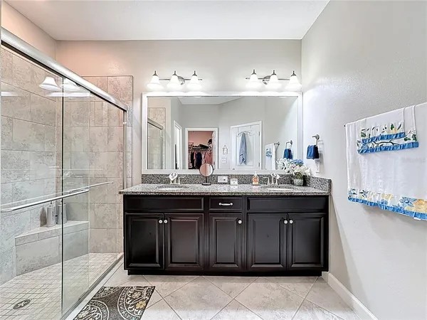 a bathroom with a shower and a sink