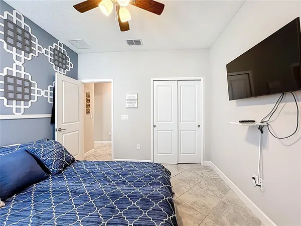 a bathroom with a sink a toilet and shower curtain