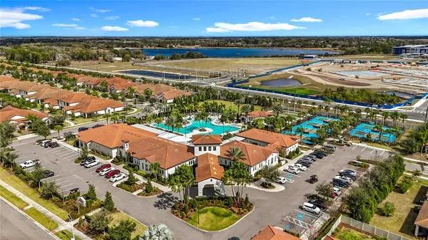 an aerial view of a dining table and chairs in the patio