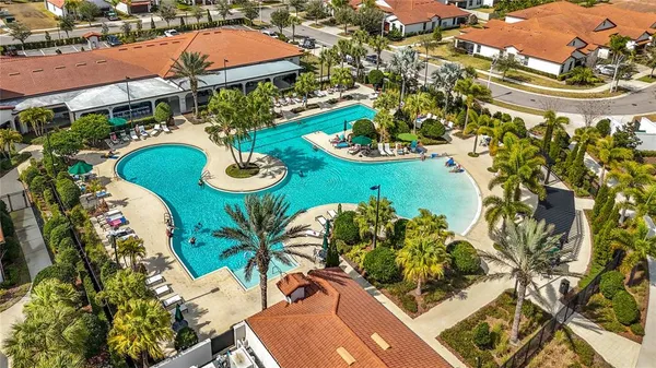 a view of a swimming pool with an outdoor seating