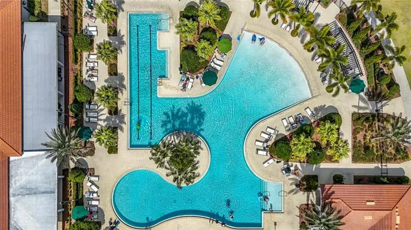 an aerial view of a swimming pool with outdoor space