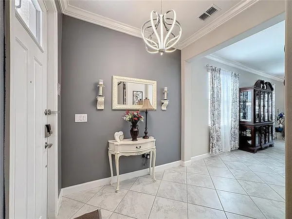 a view of an entryway with wooden floor