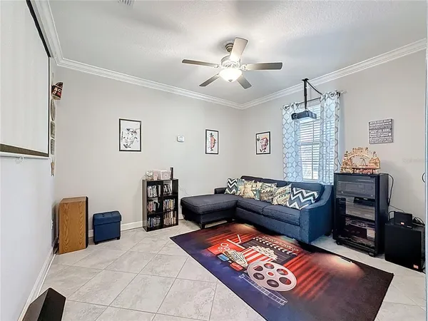 a bedroom with a bed and a couch