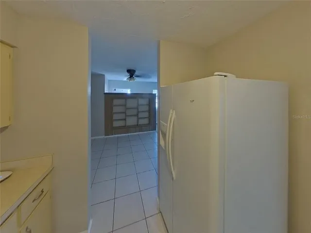 a view of walk in closet with clothes