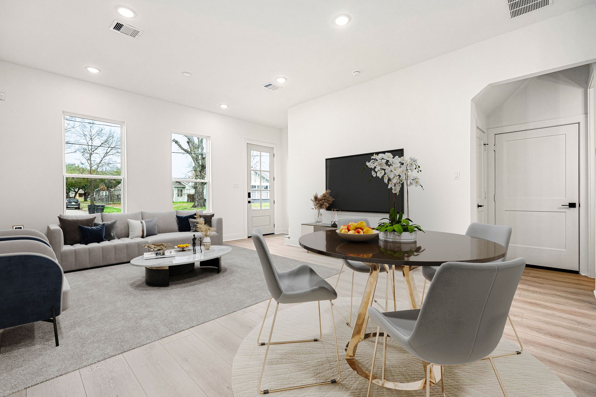 747 Dumble Street Houston, TX 77023 - Photo 5 of 18 a living room with furniture a flat screen tv and a window
