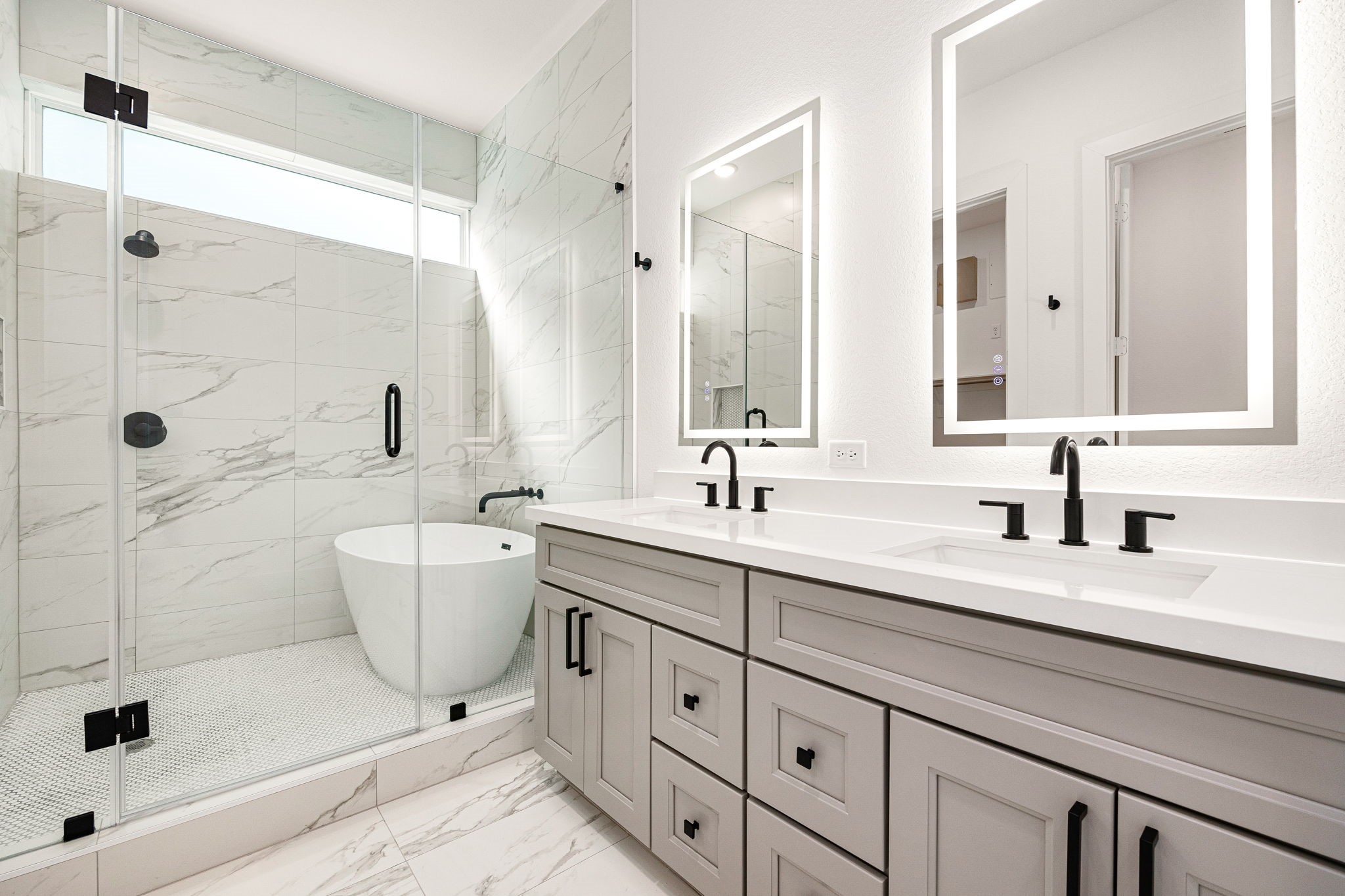 747 Dumble Street Houston, TX 77023 - Photo 8 of 18 a bathroom with a double vanity sink a toilet a mirror and shower