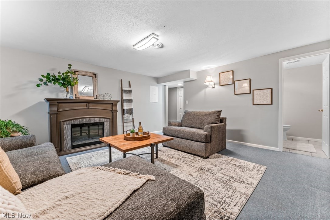 6907 Tippecanoe Road, Unit 1 Canfield, OH 44406 - Photo 17 of 26 THE FINISHED LOWER LEVEL FAMILY ROOM PROVIDES ADDITIONAL ENTERTAINMENT AND LIVING SPACE.