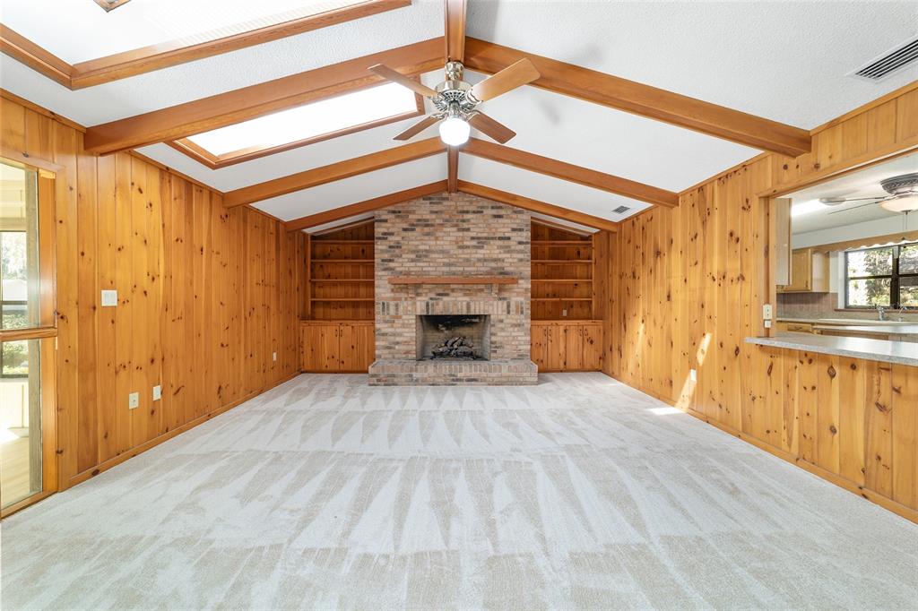 2416 Southeast 15th Street Ocala, FL 34471 - Photo 17 of 98 a view of an empty room with window and a kitchen