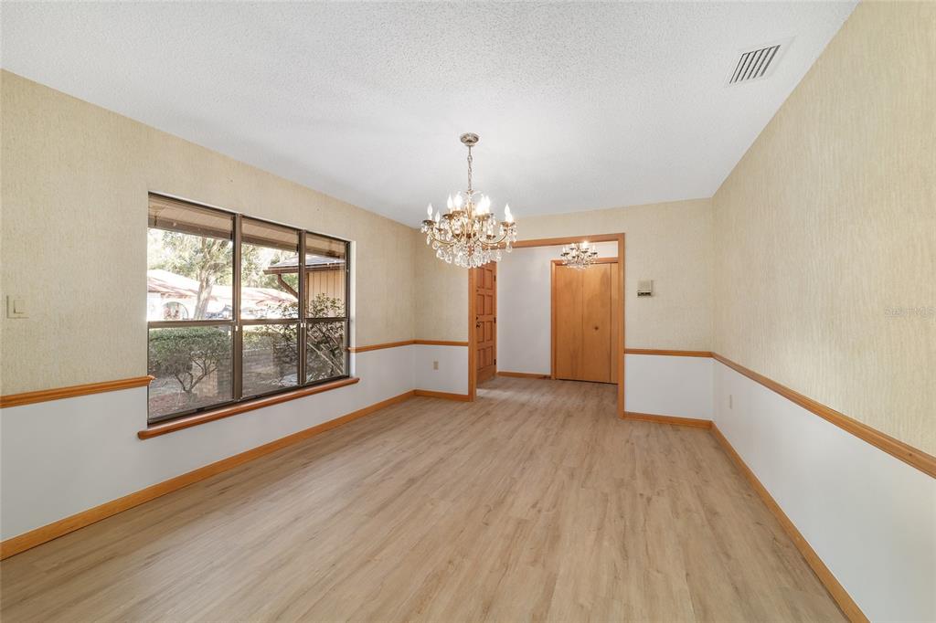 2416 Southeast 15th Street Ocala, FL 34471 - Photo 36 of 98 wooden floor in an empty room with a window