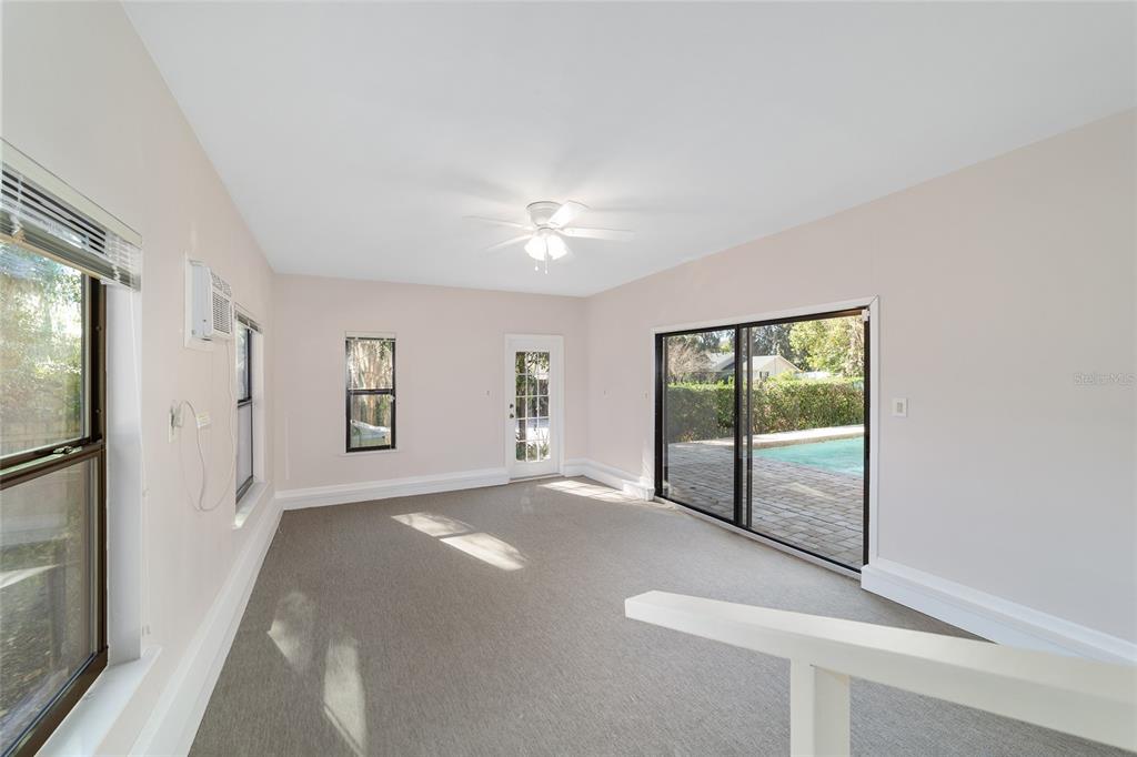 2416 Southeast 15th Street Ocala, FL 34471 - Photo 56 of 98 a view of a livingroom with a ceiling fan and window