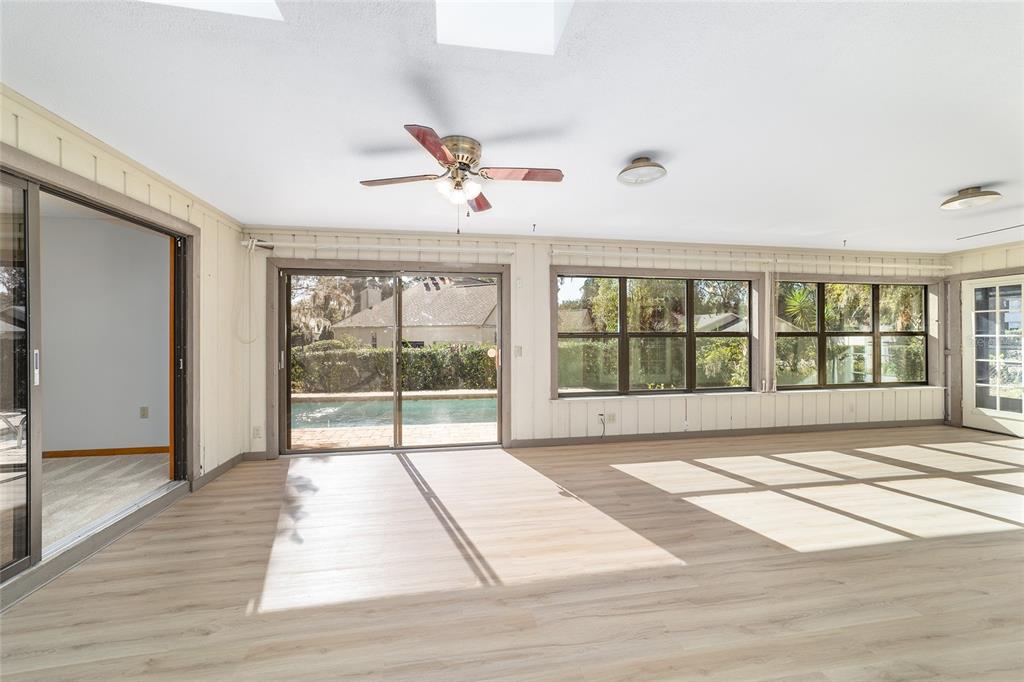 2416 Southeast 15th Street Ocala, FL 34471 - Photo 75 of 98 a view of empty room with wooden floor and fan