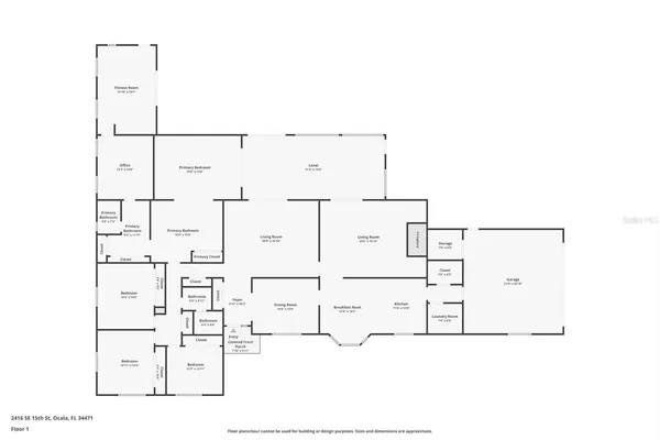a living room with furniture a fireplace and a ceiling fan