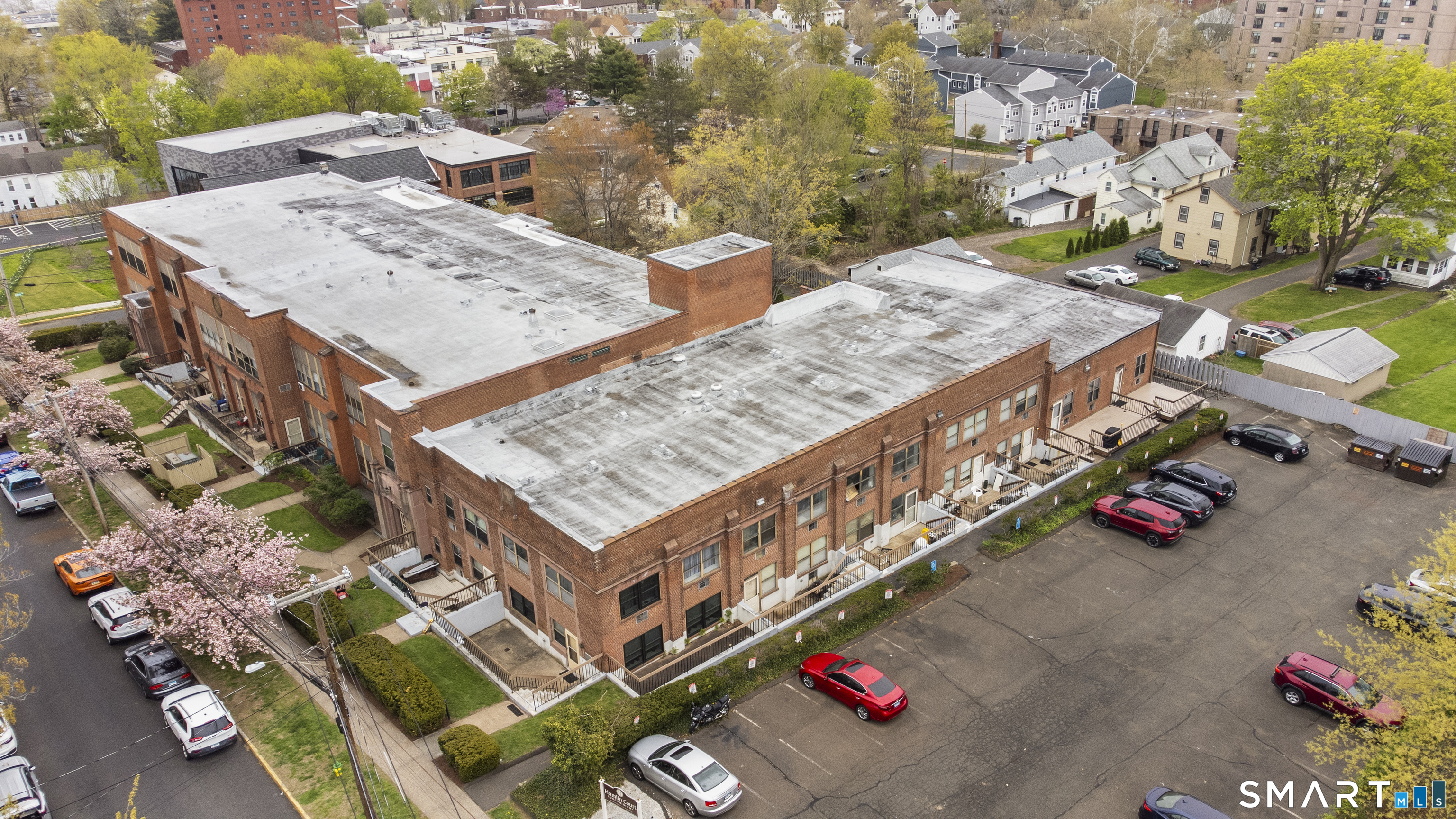 201 College Street, Unit 5 Middletown, CT 06457 - Photo 4 of 30 an aerial view of a house with balcony and outdoor seating