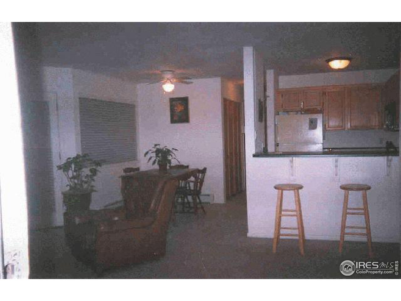 3515 28th Street, Unit 103 Boulder, CO 80301 - Photo 4 of 10 a view of a dining room with furniture and wooden floor