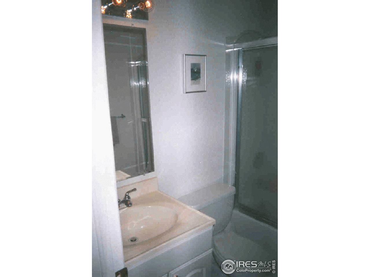 3515 28th Street, Unit 103 Boulder, CO 80301 - Photo 10 of 10 a bathroom with a sink and a mirror