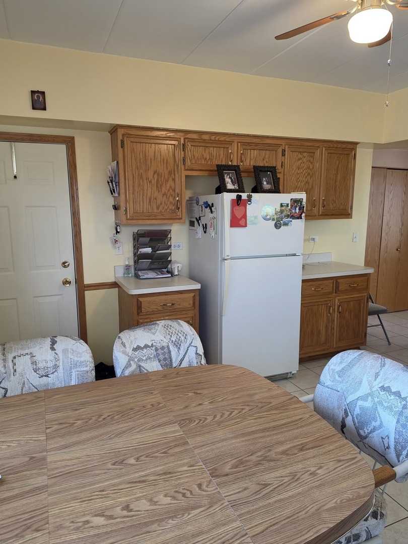 7902 Nagle Avenue, Unit 2S Burbank, IL 60459 - Photo 11 of 24 a bedroom with a bed and wooden floor