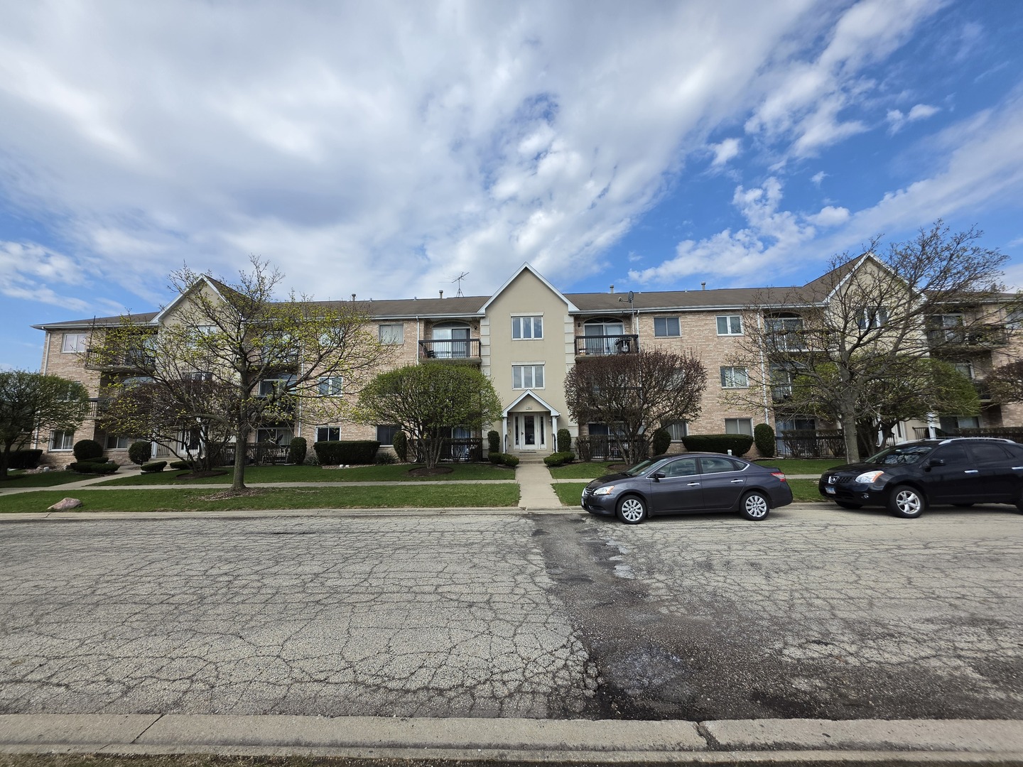 7902 Nagle Avenue, Unit 2S Burbank, IL 60459 - Photo 2 of 24 a view of a house with a yard and sitting area