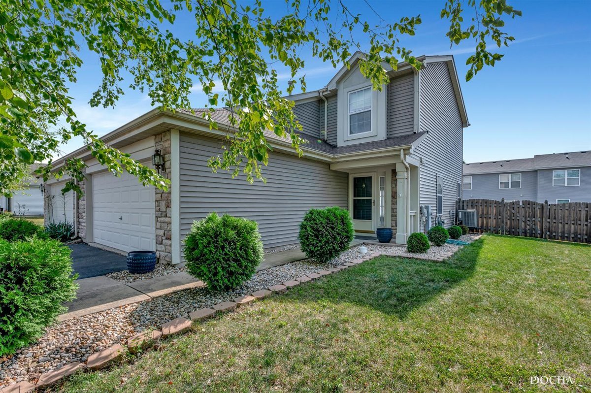 3715 Harms Road Joliet, IL 60435 - Photo 1 of 28 a front view of a house with garden