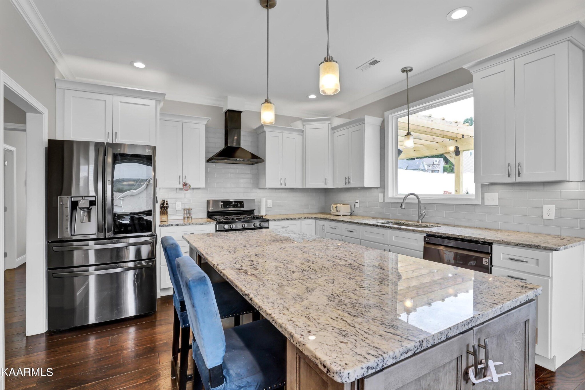 6043 Pembridge Road Knoxville, TN 37912 - Photo 13 of 49 a kitchen with granite countertop a stove a sink a refrigerator and wooden cabinets