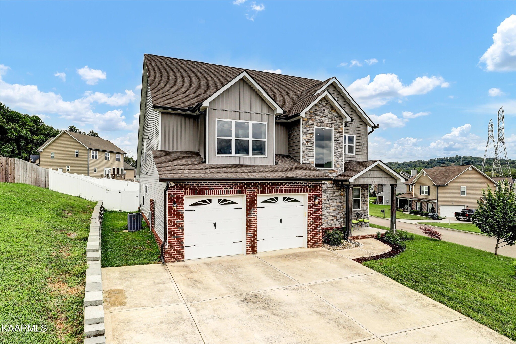 6043 Pembridge Road Knoxville, TN 37912 - Photo 2 of 49 a front view of a house with a yard and garage