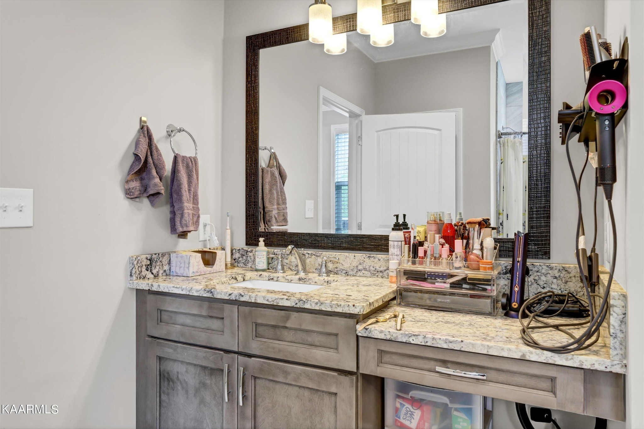 6043 Pembridge Road Knoxville, TN 37912 - Photo 23 of 49 a bathroom with a sink and a mirror