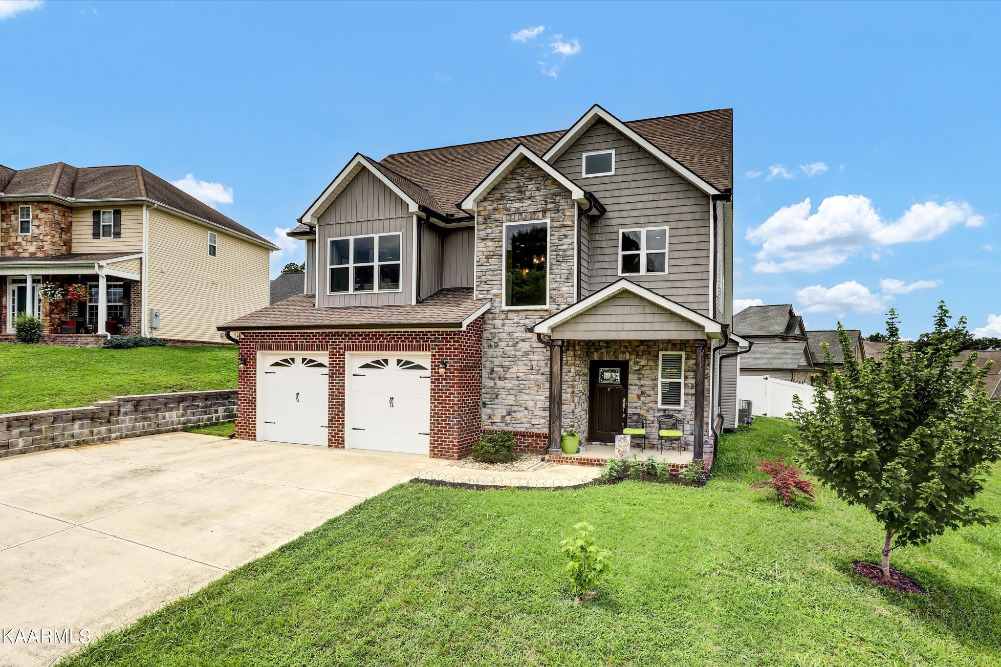 6043 Pembridge Road Knoxville, TN 37912 - Photo 3 of 49 a front view of a house with a yard and garage