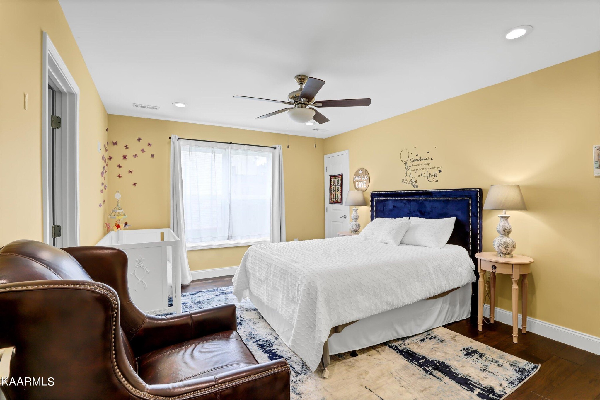 6043 Pembridge Road Knoxville, TN 37912 - Photo 39 of 49 a bedroom with a bed and a chandelier