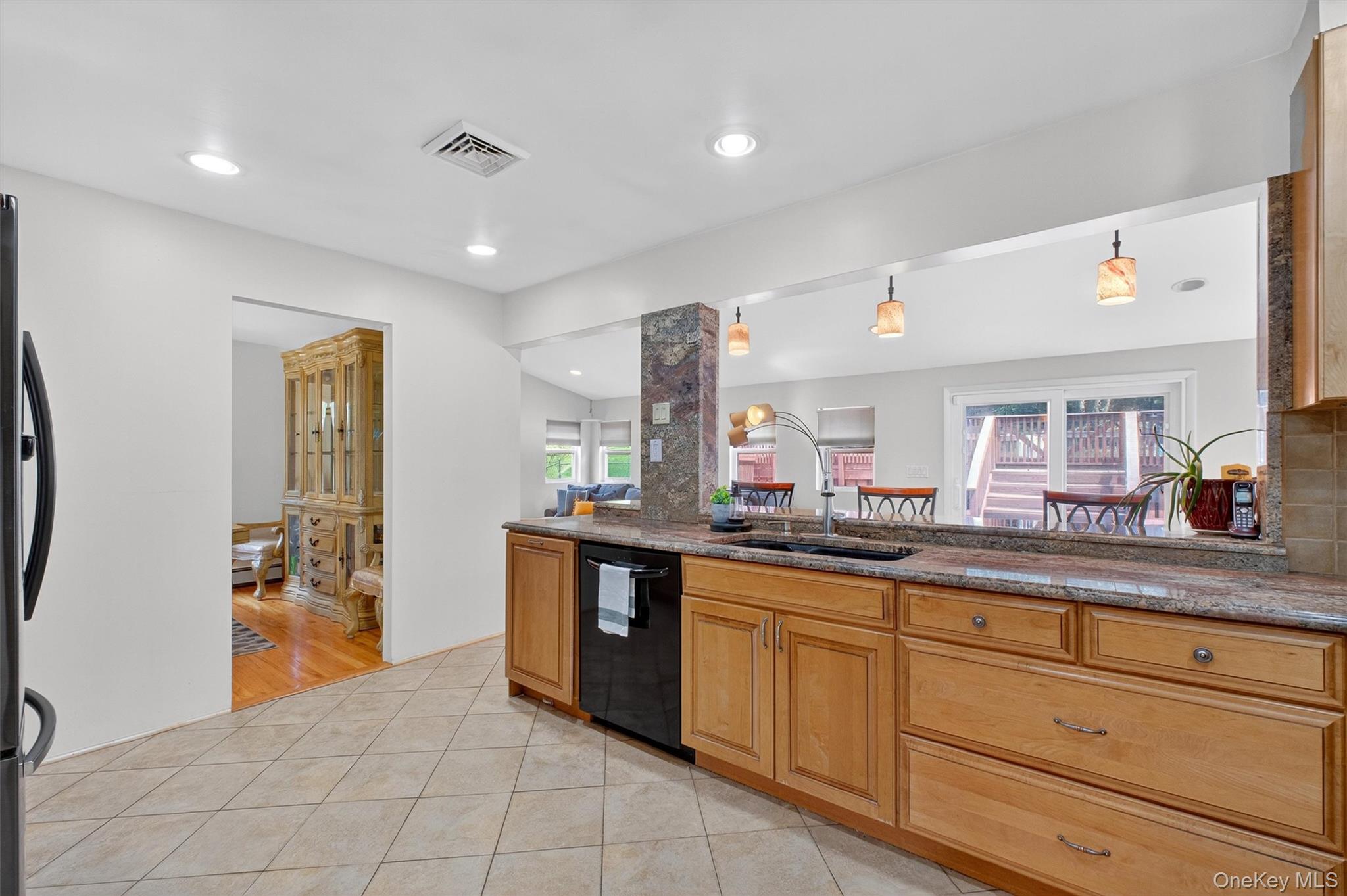 5 Verplanck Avenue Hopewell Junction, NY 12533 - Photo 15 of 50 a kitchen with granite countertop a sink and cabinets