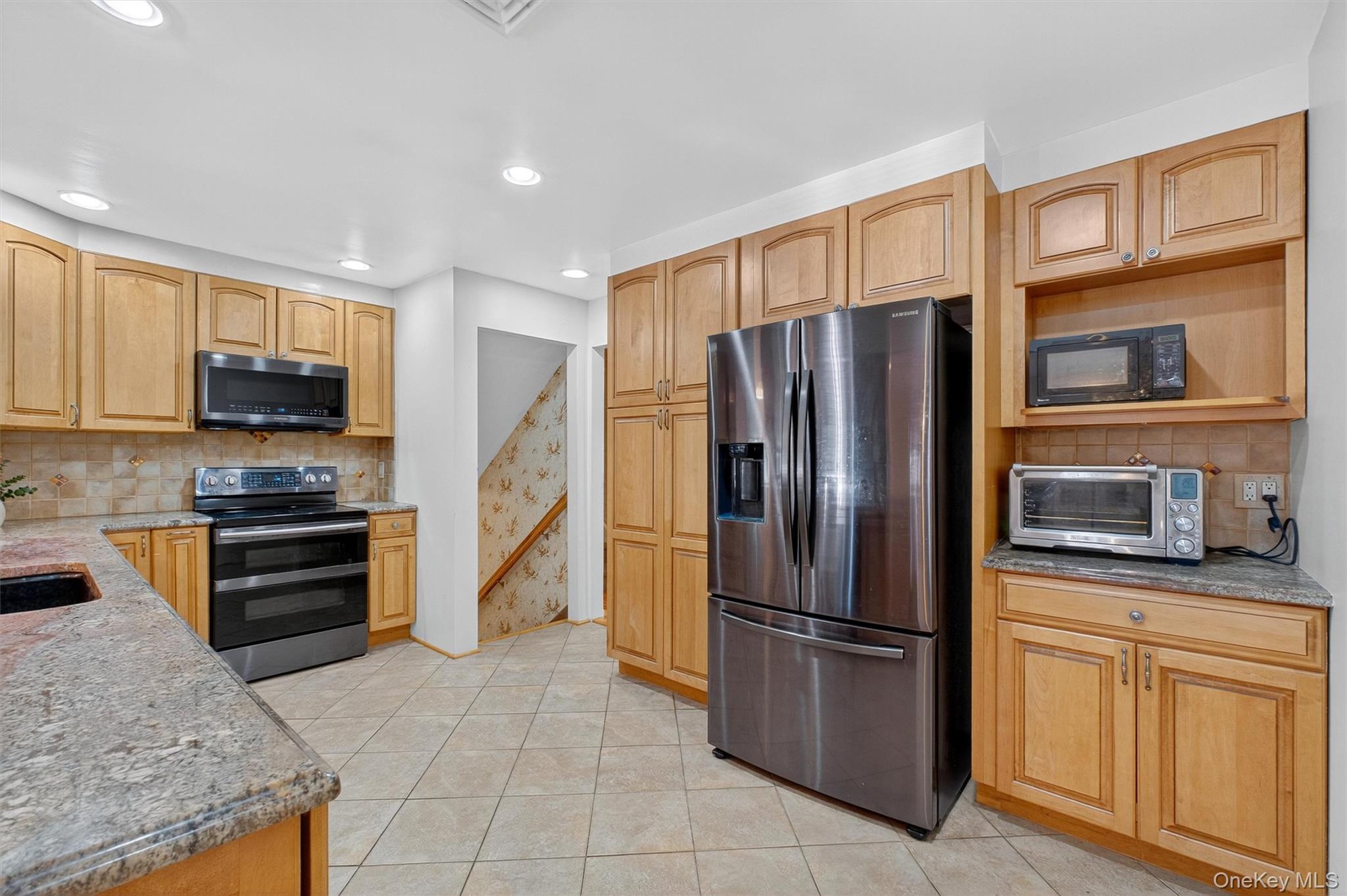 5 Verplanck Avenue Hopewell Junction, NY 12533 - Photo 17 of 50 a kitchen with stainless steel appliances granite countertop a refrigerator stove and sink