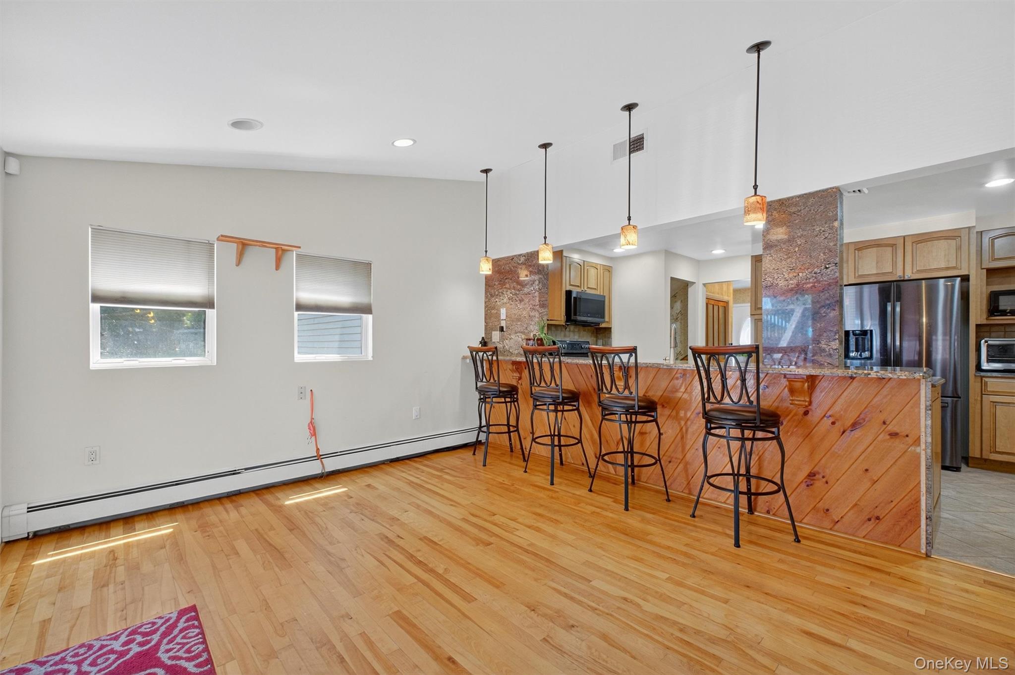 5 Verplanck Avenue Hopewell Junction, NY 12533 - Photo 19 of 50 a view of kitchen and dining room with furniture wooden floor