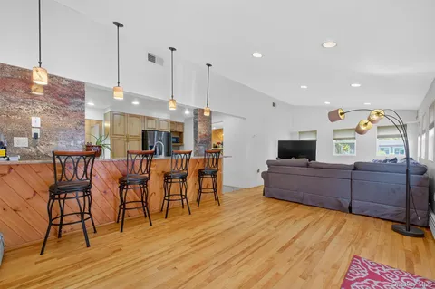 a large kitchen with a table and chairs