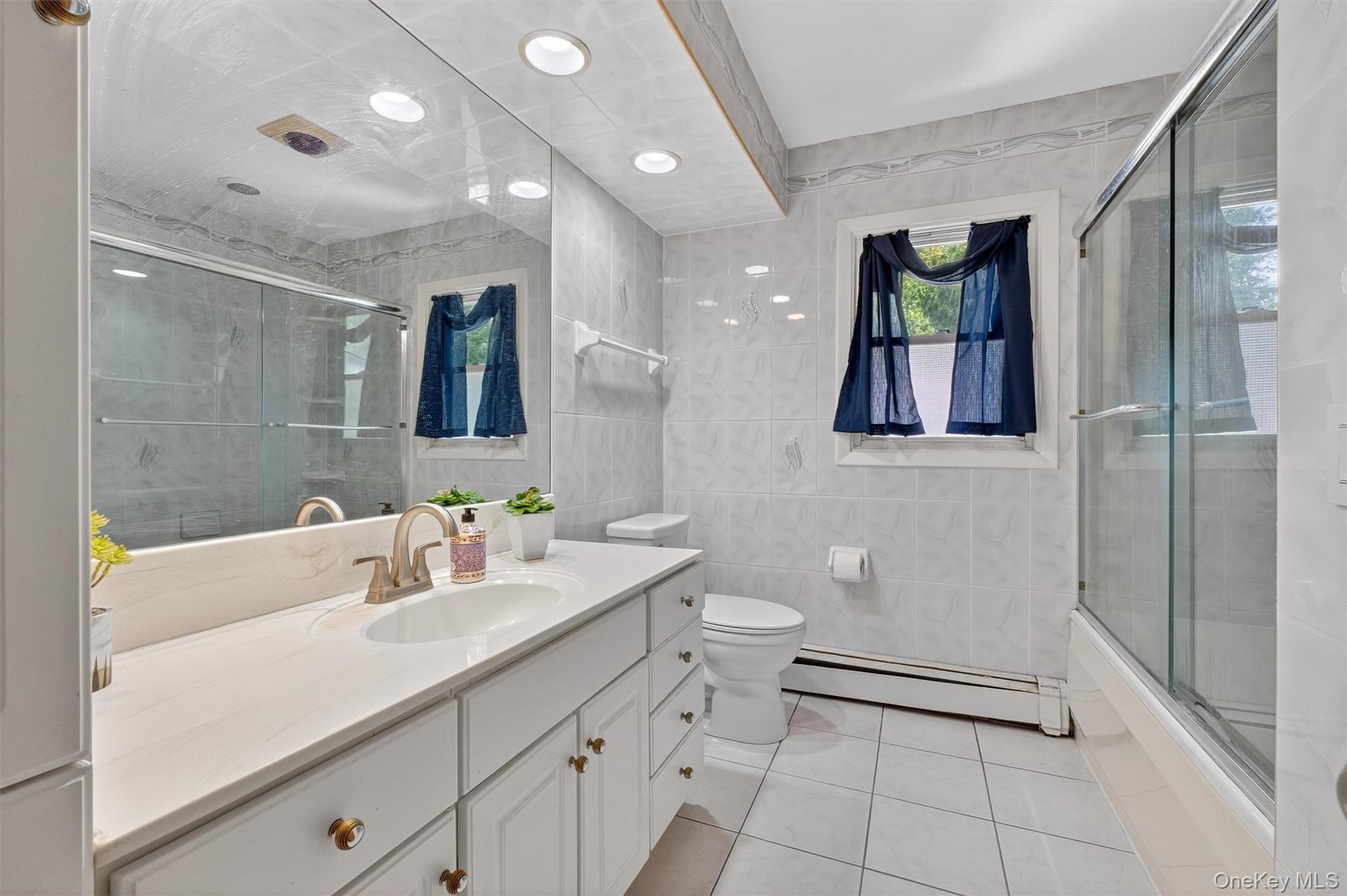 5 Verplanck Avenue Hopewell Junction, NY 12533 - Photo 24 of 50 a bathroom with a toilet sink and mirror